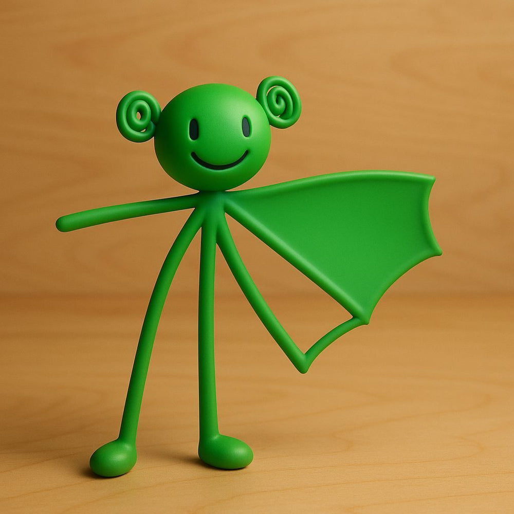 A green figurine interpretation with spiral ears and a wing, standing on a wood-coloured surface